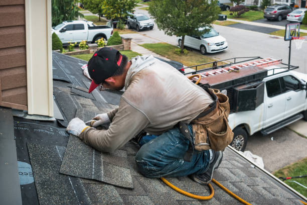 Professional Roofing technician working in Leoma, TN